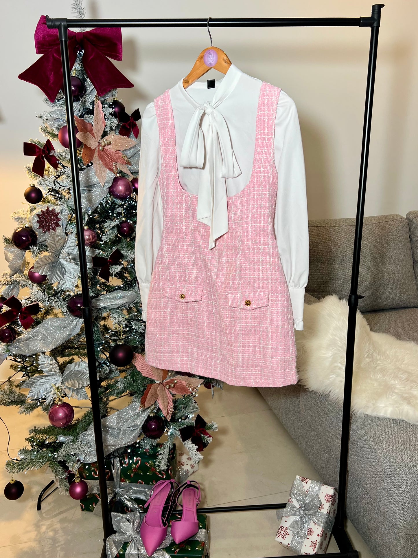 Pink plaid print overall dress with flap details, sold without a blouse.