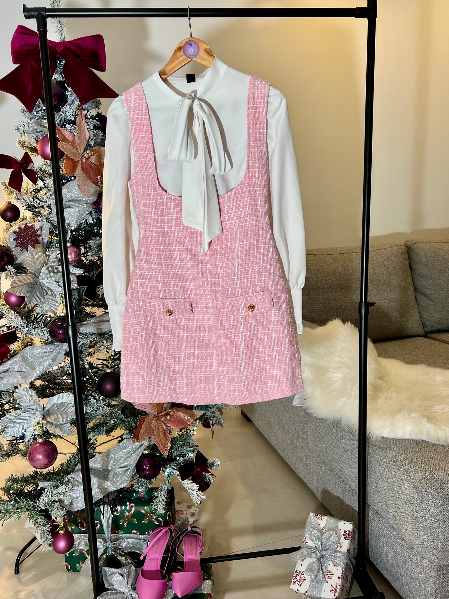 Pink plaid print overall dress with flap details, sold without a blouse.